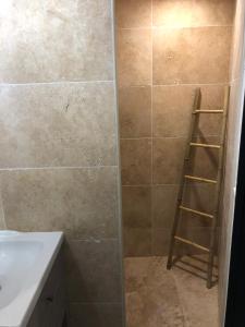 a bathroom with a shower with a ladder in it at Le petit clocher de Cassis in Cassis