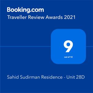 a screenshot of a phone with the text travelling review awards at Sahid Sudirman Residence - Unit 28D in Jakarta
