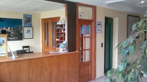 a reception desk in a hospital room with avertisementvertisementosateosateosateosateosate at Hotel Yeste in Yeste