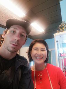 a man and a woman posing for a picture at Aekkalukthai Hostel Rayong in Rayong