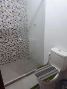 a bathroom with a shower with a toilet and a shower at Apto Jockey 3 in Campos dos Goytacazes
