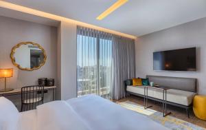 Una cama o camas en una habitación de Numa Hotel Jaffa
