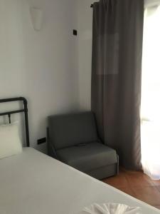 A bed or beds in a room at Villa Oasis етаж1