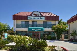 
a building with a sign on the front of it at Tarzana Inn in Tarzana
