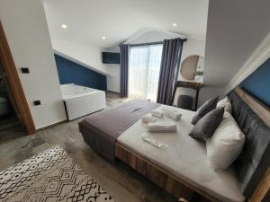 מיטה או מיטות בחדר ב-Olimpia Hotel