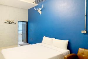 Voodi või voodid majutusasutuse SNUG·NINE Hotel toas