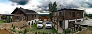 two cars parked in the courtyard of a house at Vila Residence Leo in Mariánské Lázně