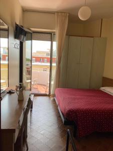 Postel nebo postele na pokoji v ubytování Hotel Flamingo
