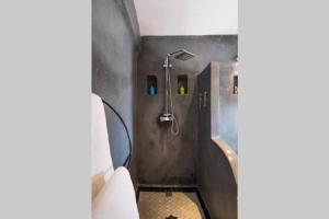 a bathroom with a shower and a toilet and a sink at COZY BUT TRENDY RETREAT IN MEDINA in Fez