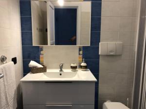 a bathroom with a sink and a toilet at La Casa Sulla Scogliera in Cefalù