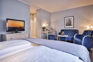 TV a/nebo společenská místnost v ubytování Sylthotel Raffelhüschen Garni
