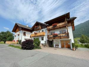 a large building with balconies on the side of it at Haus Heimat in Weissensee