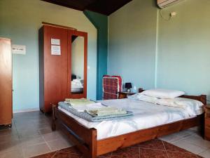 Postel nebo postele na pokoji v ubytování Galaxy Rooms