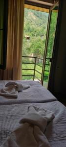Letto o letti in una camera di Lisaneli