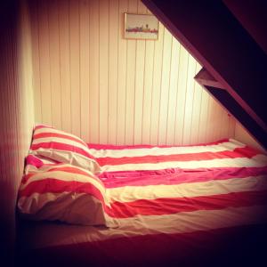 Кровать или кровати в номере Huisje San Francisco op Terschelling