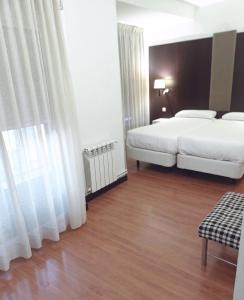 Postel nebo postele na pokoji v ubytování Hotel Delta
