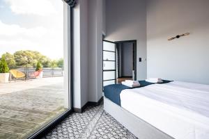 Posteľ alebo postele v izbe v ubytovaní Salio Equisport Resort