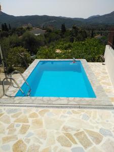 a swimming pool in a villa with a view at Apartment with private pool for rent in Tzanata Kefalonia in Dhimisianáta