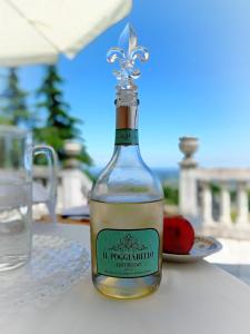 a bottle of wine sitting on top of a table at Villa La Palazzina in Agazzano