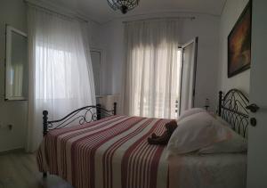 A bed or beds in a room at Emily`s vacation house