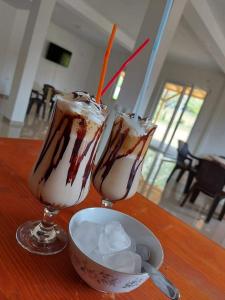 two glasses of milkshakes sitting on a table at The Brothers Villa Hotel in Ohrid