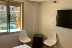 TV a/nebo společenská místnost v ubytování Cosy Duplex, dans résidence avec piscine