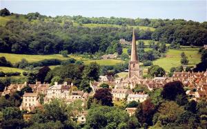 a small town with a church and a town with a tower at St Annes Bed and Breakfast in Painswick