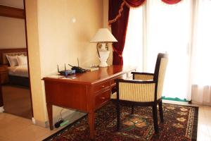 Postel nebo postele na pokoji v ubytování Travellers Suites Serviced Apartments