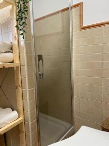 a shower with a glass door in a bathroom at Casa Carmen by VG in Maro +14 photos