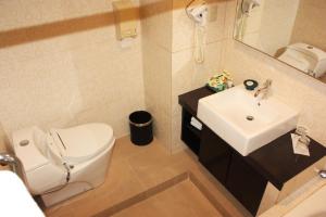 Koupelna v ubytování Travellers Suites Serviced Apartments
