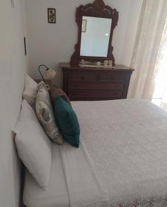 Postel nebo postele na pokoji v ubytování Il terrazzo dei nonni