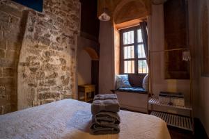 Postel nebo postele na pokoji v ubytování DOMUS AMABILIS - ESPAI GAETA