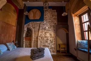 Postel nebo postele na pokoji v ubytování DOMUS AMABILIS - ESPAI GAETA