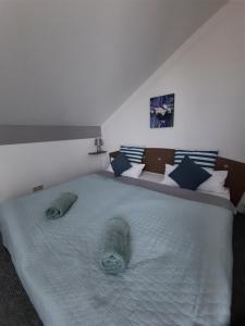 Posteľ alebo postele v izbe v ubytovaní Kamilla Apartman Villapark