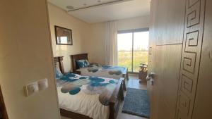 מיטה או מיטות בחדר ב-PRESTIGIA ESSAOUIRA MOGADOR Luxury Ocean View
