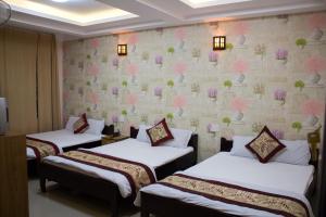 Katil atau katil-katil dalam bilik di Thanh Long Da Lat Hotel