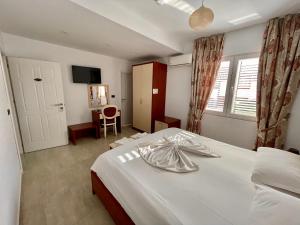 Postel nebo postele na pokoji v ubytování Vila Ada Hotel
