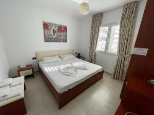 Postel nebo postele na pokoji v ubytování Vila Ada Hotel