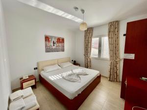 Postel nebo postele na pokoji v ubytování Vila Ada Hotel
