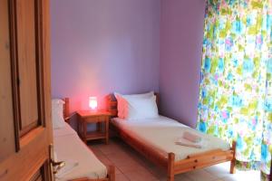 Postel nebo postele na pokoji v ubytování Kolios Seaside Apartments