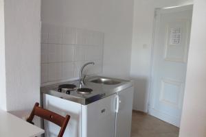 Kuchyň nebo kuchyňský kout v ubytování Kolios Seaside Apartments + 37 fotografií