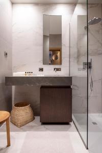 a bathroom with a sink and a shower at Chateau de Wallerand in Vireux-Wallerand