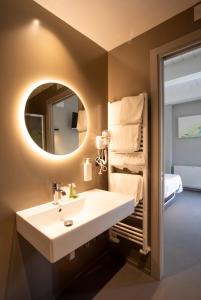 a bathroom with a sink and a mirror at Country House La Cipolla D'oro in Potenza Picena