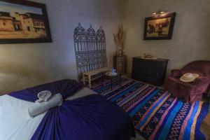 Postel nebo postele na pokoji v ubytování Riad Nabila