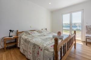 Postel nebo postele na pokoji v ubytování Apartments Lino