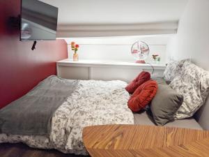 Rêves Paisibles Rubis - Choisy tesisinde bir odada yatak veya yataklar
