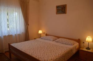 Posteľ alebo postele v izbe v ubytovaní Rooms & Apartments Kvasić