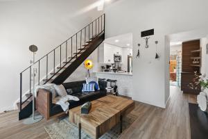 a living room with a couch and a table at Contemporary Couples Getaway Near Austin Favorites - Loft 21 in Austin