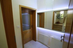 a hallway with a door and a mirror at Apartments Ivana - Iva in Zadar +40 photos