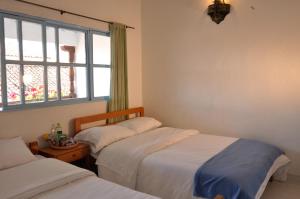 Laureles de la Villa客房内的一张或多张床位